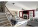 Cozy living room with a fireplace and comfortable seating at 157 Donovan Ave, Locust Grove, GA 30248