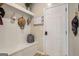 Mudroom includes coat hooks, seating and storage at 157 Donovan Ave, Locust Grove, GA 30248