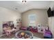 The playroom includes pink tables, a ball pit and a small couch at 157 Donovan Ave, Locust Grove, GA 30248