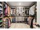 Spacious walk-in closet featuring custom storage solutions and hardwood style floors at 157 Donovan Ave, Locust Grove, GA 30248