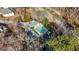 Aerial view showcasing a community pool with a sun deck, lush landscaping, and surrounding residences at 1160 Strath Clyde Way, Mcdonough, GA 30253