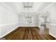 Dining room featuring trey ceiling, wood floors, large window and chandelier lighting at 1160 Strath Clyde Way, Mcdonough, GA 30253