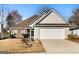 Charming home featuring a two-car garage, small garden, and inviting curb appeal at 1160 Strath Clyde Way, Mcdonough, GA 30253