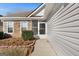 The front porch has decorative stonework and a storm door entrance at 1160 Strath Clyde Way, Mcdonough, GA 30253