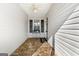 Charming enclosed front porch features stylish tile flooring, a ceiling fan, and ample natural light at 1160 Strath Clyde Way, Mcdonough, GA 30253