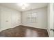 Bedroom with wood floors, natural light, and closet storage at 2050 Federal Rd, Roswell, GA 30075