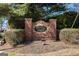 Charming brick community entrance sign for Bristol Oaks, set amidst lush greenery and landscaping at 2050 Federal Rd, Roswell, GA 30075