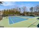 Well-maintained tennis courts under a clear blue sky, perfect for enjoying outdoor recreation at 2050 Federal Rd, Roswell, GA 30075