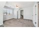 Bedroom features gray carpet, a ceiling fan, and closet at 252 Turnbridge Cir, Peachtree City, GA 30269