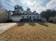 Charming one-story home featuring dormer windows, covered entry porch, and a two-car garage at 2260 Burdett Ridge Dr, South Fulton, GA 30349