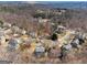 Community with winding roads and lush treescape and beautiful homes at 6448 Mobilis Ct, Sugar Hill, GA 30518