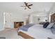 Large main bedroom featuring sitting area, vaulted ceilings, and wood furnishings at 6448 Mobilis Ct, Sugar Hill, GA 30518