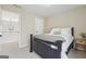 Comfortable bedroom with soft, neutral walls and a view into another room at 6448 Mobilis Ct, Sugar Hill, GA 30518