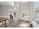 Open-concept foyer with high ceilings, wood floors, and great natural light at 6448 Mobilis Ct, Sugar Hill, GA 30518