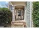 Inviting front entrance with classic architectural details and a brick-paved walkway at 6448 Mobilis Ct, Sugar Hill, GA 30518