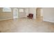 Bright living room with tile flooring, archways, and a classic bench at 6448 Mobilis Ct, Sugar Hill, GA 30518