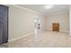 Spacious living room features beautiful tile flooring and an archway leading to the rest of the house at 6448 Mobilis Ct, Sugar Hill, GA 30518