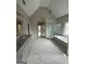 Bright bathroom with white marble tile, soaker tub and glass shower at 829 Artistry Way, Fairburn, GA 30213