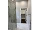 Elegant bathroom showcasing a glass-enclosed shower and access to walk-in closet at 829 Artistry Way, Fairburn, GA 30213