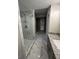 Bathroom featuring a glass-enclosed shower, marble tile flooring, and vanity with granite countertop at 829 Artistry Way, Fairburn, GA 30213