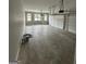 Spacious three car garage with multiple windows and concrete floors at 829 Artistry Way, Fairburn, GA 30213