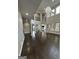 Spacious living room boasts an open floor plan, high ceilings, and elegant chandelier at 829 Artistry Way, Fairburn, GA 30213