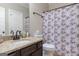 Bathroom featuring granite countertops and a shower with patterned curtains at 101 Dean Cir, Mcdonough, GA 30253