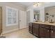 Bathroom featuring double vanities and a large window for natural light at 101 Dean Cir, Mcdonough, GA 30253