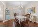 Bright dining room features a chandelier and hardwood floors at 101 Dean Cir, Mcdonough, GA 30253