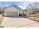 Detached garage with a wide driveway and seating area at 101 Dean Cir, Mcdonough, GA 30253