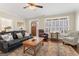 Cozy living room featuring beautiful hardwood floors and plantation shutters at 101 Dean Cir, Mcdonough, GA 30253