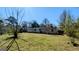 View of home's backyard featuring a well-maintained lawn and a single story house at 4214 Canby Ln, Decatur, GA 30035