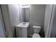 Traditional bathroom with white vanity, toilet, and medicine cabinet at 4214 Canby Ln, Decatur, GA 30035