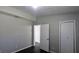 Bedroom featuring neutral paint, dark laminate flooring, and closet at 4214 Canby Ln, Decatur, GA 30035