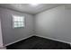 Bedroom with natural light, dark wood-look floors, and neutral wall paint at 4214 Canby Ln, Decatur, GA 30035