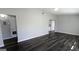 Spacious living room with modern gray walls and newly installed, dark-stained laminate flooring throughout at 4214 Canby Ln, Decatur, GA 30035