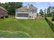Expansive backyard featuring lush lawn and mature trees, perfect for outdoor activities and relaxation at 1283 Heritage Dr, Villa Rica, GA 30180
