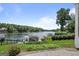 Expansive backyard with well manicured lawn leading to a private dock on a beautiful lake at 1283 Heritage Dr, Villa Rica, GA 30180