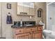 Well-maintained bathroom with a dark countertop, wooden cabinets, and a walk-in shower at 1283 Heritage Dr, Villa Rica, GA 30180