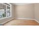 Bright bedroom featuring hardwood floors, neutral wall color, and large window offering ample natural light at 1283 Heritage Dr, Villa Rica, GA 30180