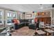 Comfortable living room features a large black leather sectional with lake views and a bar area at 1283 Heritage Dr, Villa Rica, GA 30180