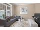 Comfortable living room with stylish sectional sofa, piano, and modern decor, creating an inviting space at 1283 Heritage Dr, Villa Rica, GA 30180