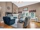 Cozy living room with hardwood floors, fireplace, and large windows at 1283 Heritage Dr, Villa Rica, GA 30180