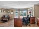 Spacious office featuring a desk, comfortable seating and large windows with lots of natural light at 1283 Heritage Dr, Villa Rica, GA 30180