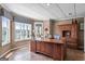 Well-lit home office with large windows offering serene lake views, complete with built-in shelves at 1283 Heritage Dr, Villa Rica, GA 30180
