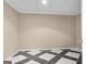 Storage room featuring black and white tile flooring and neutral colored walls at 1283 Heritage Dr, Villa Rica, GA 30180
