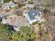 Aerial view showcasing the design and location of a luxury home with a spacious backyard at 210 Steeple Point Dr, Roswell, GA 30076