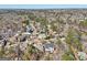 Aerial view of a residential community featuring well-maintained lawns and mature trees at 210 Steeple Point Dr, Roswell, GA 30076