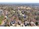 Picturesque aerial view showcases a luxury home community with mature trees and landscaping at 210 Steeple Point Dr, Roswell, GA 30076