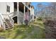 Backyard with a patio area, offering outdoor seating and a serene view of the surrounding landscape at 210 Steeple Point Dr, Roswell, GA 30076